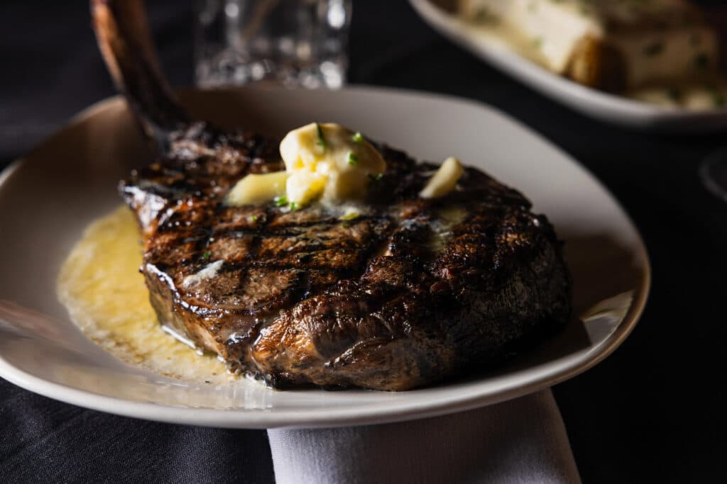 A 36oz Tomahawk steak with melting butter from Bowdie's Chophouse in Hilton Head, SC.