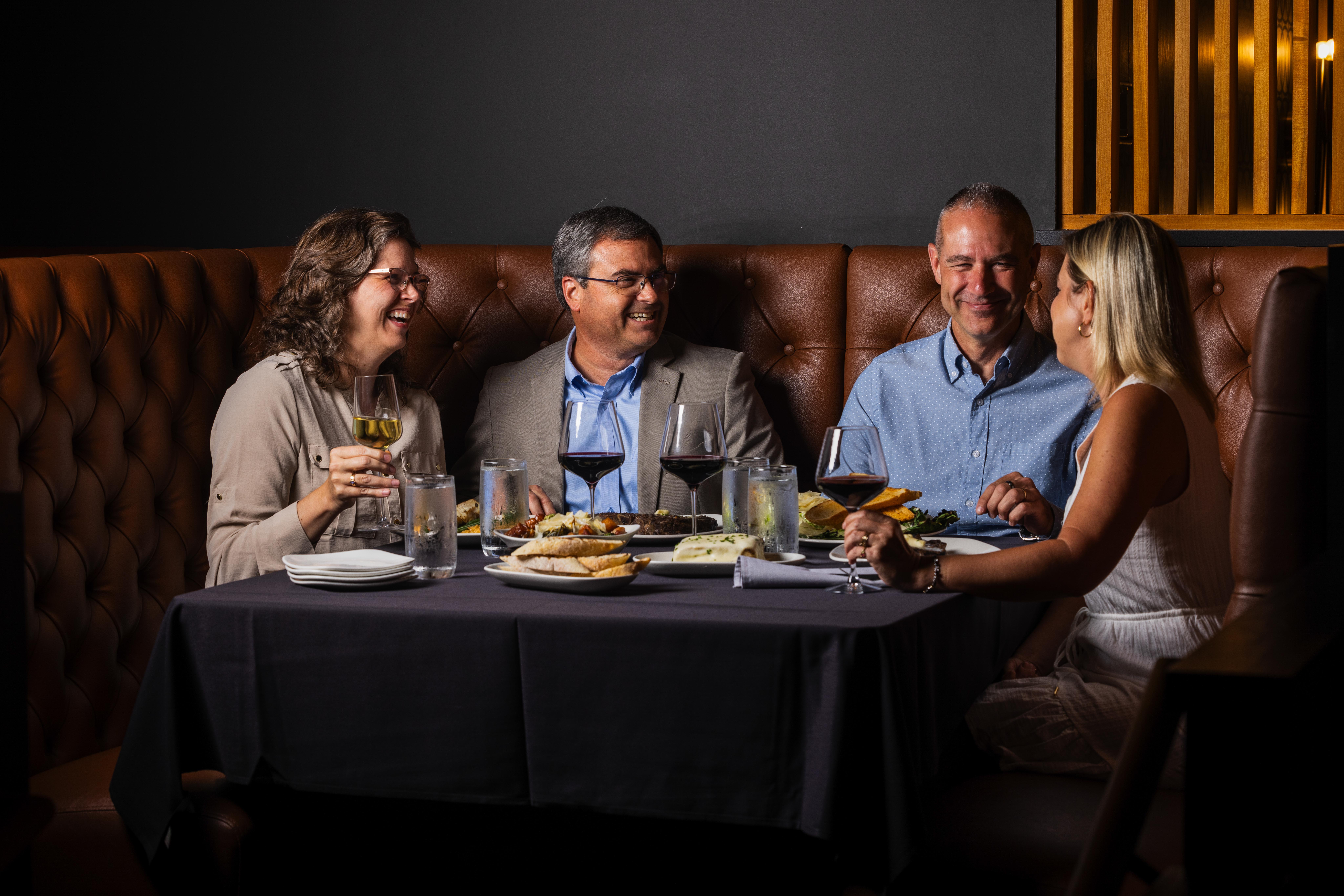 A group of four dining at Bowdie's Chophouse