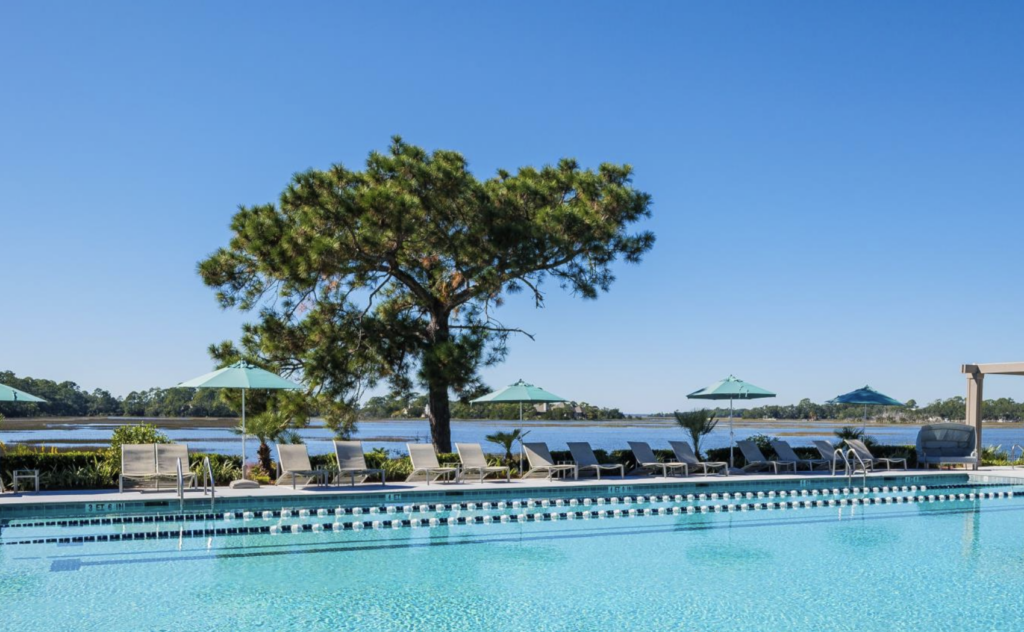 Picturesque view of the pool and lounge chairs at Sea Pines Country Club