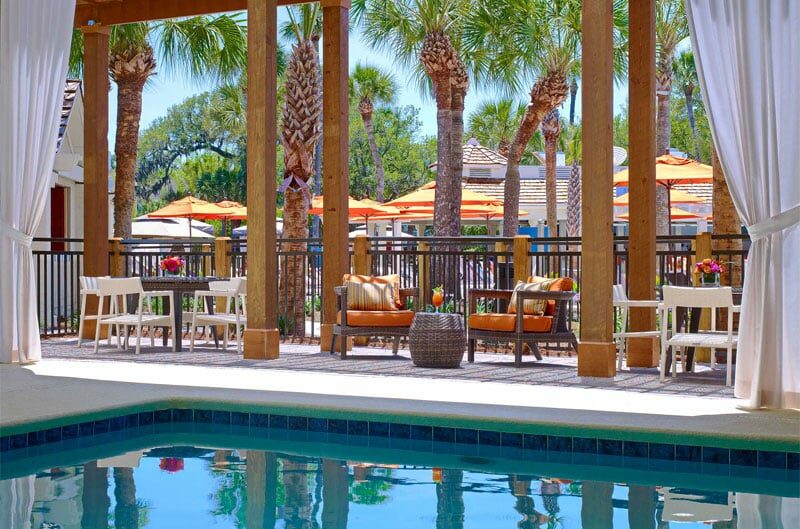 Tropical palm trees sit in the background of this luxurious pool at Sonesta Resort in Hilton Head